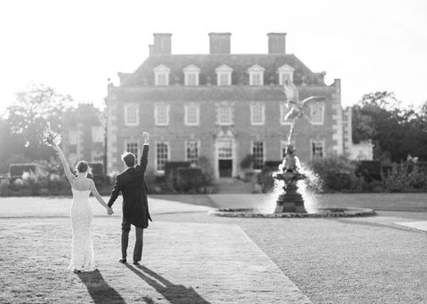 Bride and Groom in the Garden at St Giles House Rupert and Sophie Camilla Arnhold Photography Gecko Live Entertainment