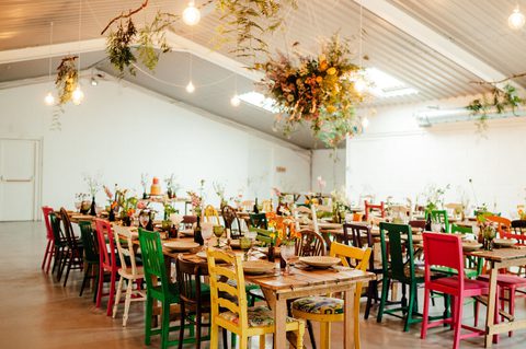 Colourful chairs at Avington Barn Wedding Venue Hampshire